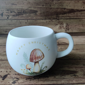 Holiday Mug with mushroom motif and writing Merry Christmas
